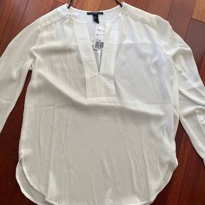Two long sleeve white blouses